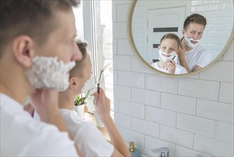 Father son shaving bathroom mirror