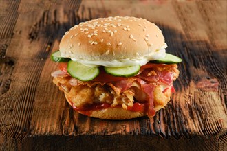 Chicken fresh burger with bacon and fresh cucumber