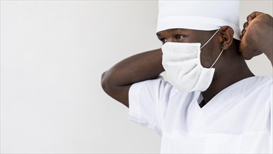 Specialist male doctor putting mask portrait