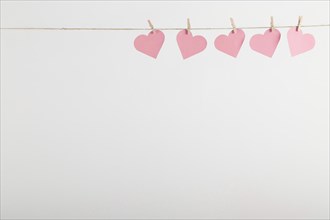 Pink paper hearts hanging rope