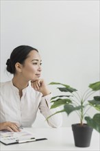 Pretty asian woman sitting her workplace