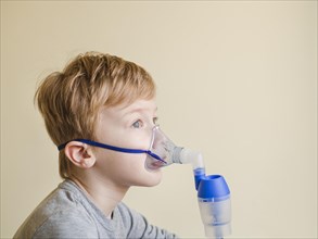 High angle boy with oxygen mask