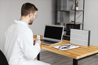 Medium shot doctor desk