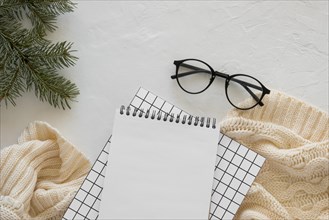 Top view stationery empty papers with reading glasses