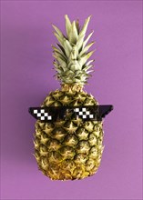 Top view pineapple wearing glasses