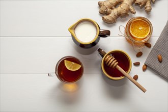 Top view cup tea with honey orange slice