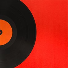 Close up vinyl record red background