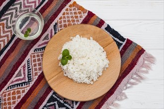 Cooked rice wooden board with water