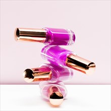Pink shades stacked nail polish bottle