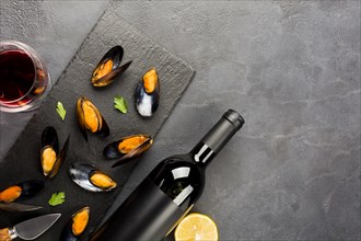 Flat lay cooked mussels wine with copyspace