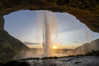 Seljalandsfoss waterfall at sunset