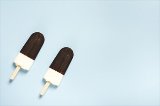 Pair ice cream half chocolate sticks