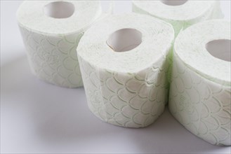 Rolled up toilet paper isolated white background