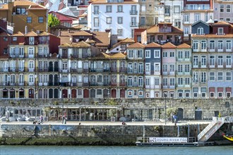Typical houses on the Douro promenade Cais de Ribeira in the old town of Porto