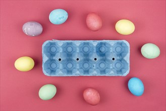 Colourful easter eggs with blue box table