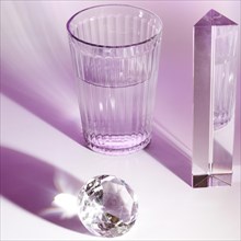 Crystal glass water prism shiny diamond pink background