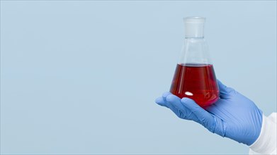 Front view scientist holding red chemical with copy space