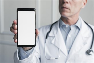 Doctor showing mobile phone