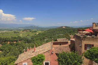 View over the houses of Roussillon into the landscape of the Luberon
