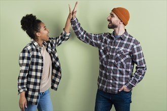 Couple posing while high fiving