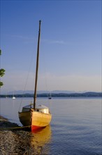 Small sailboat on the shore