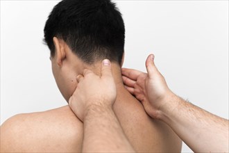 Man getting neck massage from physiotherapist