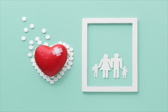 Top view world heart day concept with family frame