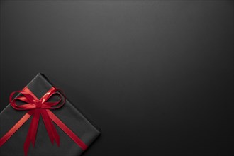 Wrapped black gift with copy space