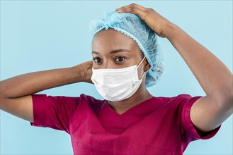 Woman medic wearing surgeon mask