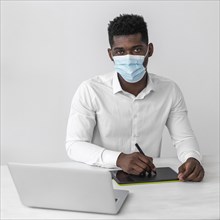 African american man wearing medical mask work