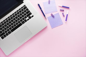 Laptop supplies with pink background