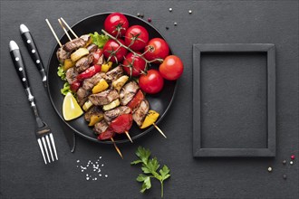 Top view plate with delicious kebab frame