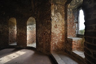 Room with window seat in recess inside medieval Beersel Castle