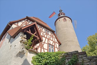 Historic tower with German national flag at the Kurmainzisches Schloss