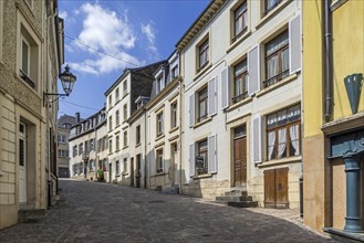 Old houses along cobbled street in the city Bouillon