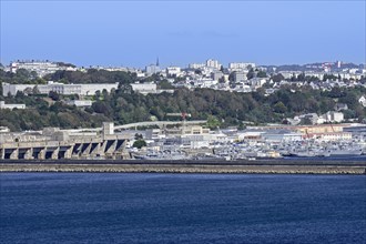 View over German WW2 U-boat submarine pen and French Navy ships docked in the port