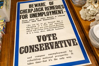 1930s Vote Conservative election poster on display in auction room