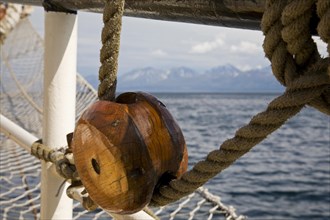 Wooden pulley on board of the tall ship