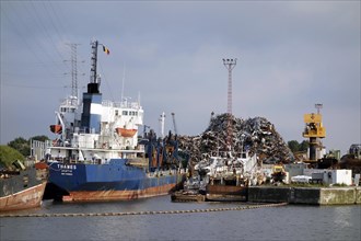 Old ship being dismantled to recycle scrap metal at Van Heyghen Recycling export terminal
