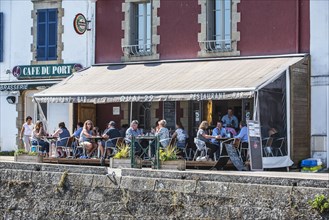 Tourists at restaurant bar along the quay at Douarnenez