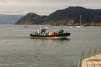 Supply boat bringing supplies to Cies islands