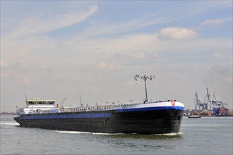 Inland vessel sailing into dock of the Antwerp harbour