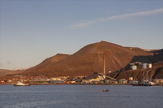 The Longyearbyen harbour seen from the bay at midnight sun in summer