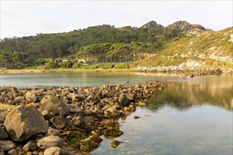 View over lagoon at low tide to camp site on Isla del Faro