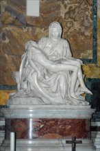 Frontal view of marble sculpture Sculpture in white marble from Carrara Pieta by Michelangelo Mary Mother of God mourns holds son