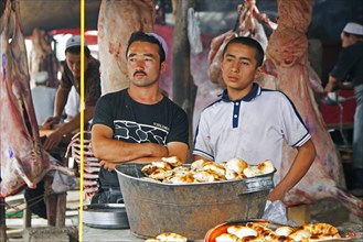 Meat for sale at butcher's stall at the food market in Kashgar