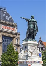 Statue of Jacob Van Artevelde and Bond Moyson building in art nouveau style at the Friday Market