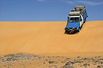 Four-wheel drive vehicle in the Sahara desert