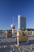 The Maritim Hotel and roofed wicker beach chairs at Travemuende