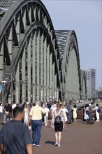 People crossing the Rhine on the Cologne Hohenzollern Bridge in the city centre
